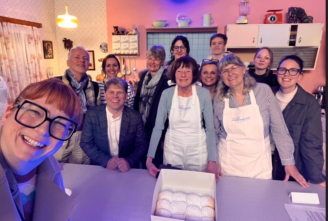 Team enjoying snacks and drinks during the baking class
