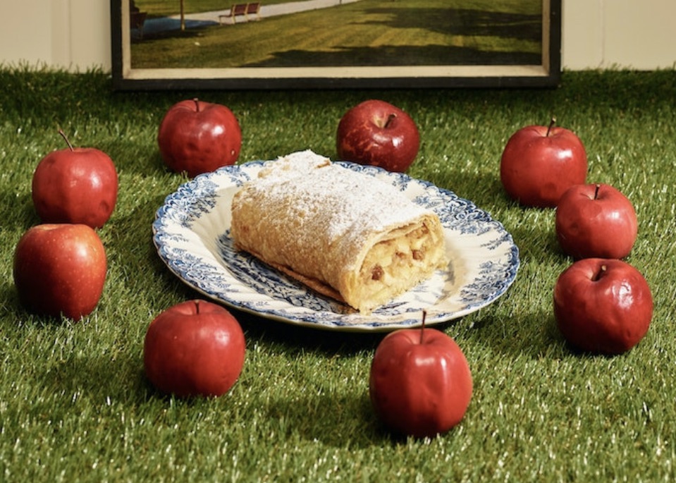 Viennese apple strudel dough being stretched paper-thin – baking course at Vollpension Vienna