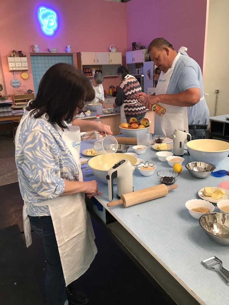 Group baking experience at Vollpension Vienna – hands-on pastry making with grandmothers and grandfathers